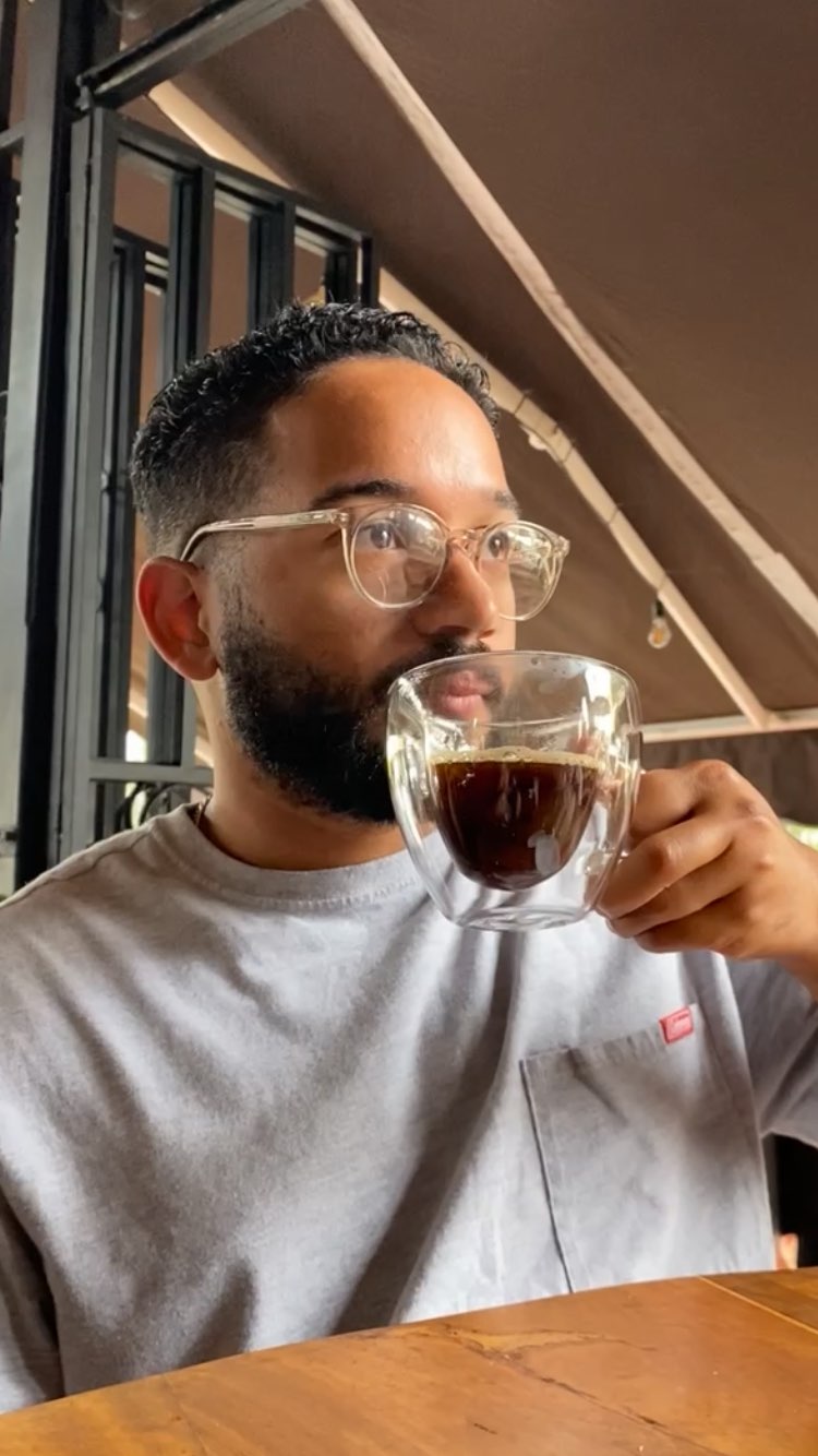 Bryan Pizarro enjoying a cup of coffee